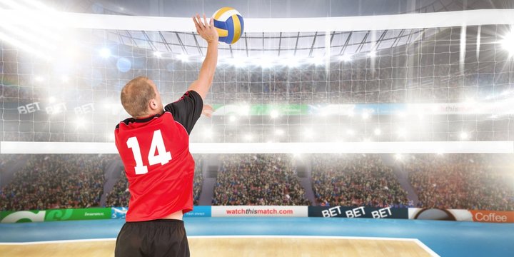Composite image of rear view of sportsman hitting volleyball