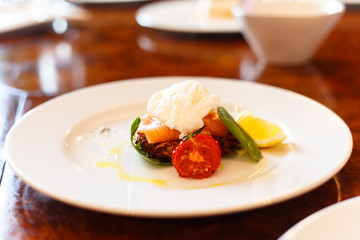 Scrambled eggs with salmon is on the plate.