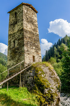 ancient stone tower in Georgia, mountain background