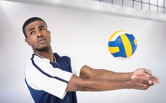 Composite image of sportsman playing volleyball