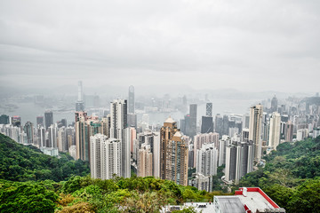 Obraz premium Business concept for real estate and corporate construction - panoramic modern city skyline bird eye aerial view with morning grey sky in Hong Kong (HK), China