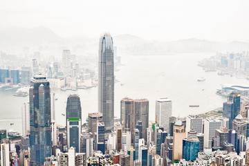 Business concept for real estate and corporate construction - panoramic modern city skyline bird eye aerial view with morning grey sky in Hong Kong (HK), China