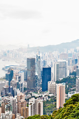 Business concept for real estate and corporate construction - panoramic modern city skyline bird eye aerial view with morning grey sky in Hong Kong (HK), China