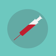 Syringe with blood on green background