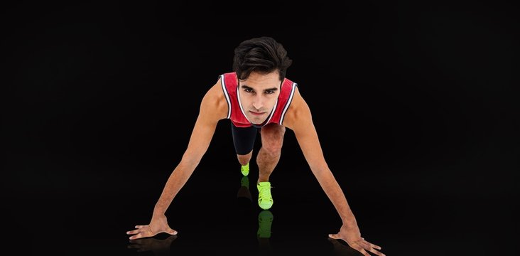 Composite image of male athlete in ready to run position