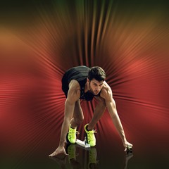 Composite image of sportsman waiting on the starting block