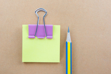 Color  Paper notes with sticky note on brown Background