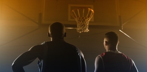 Fototapeta premium Two basketball player looking the basketball hoop