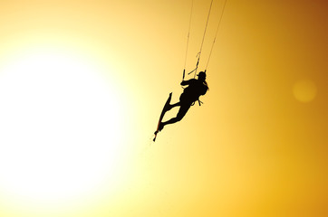 Kite jump under sunset sun
