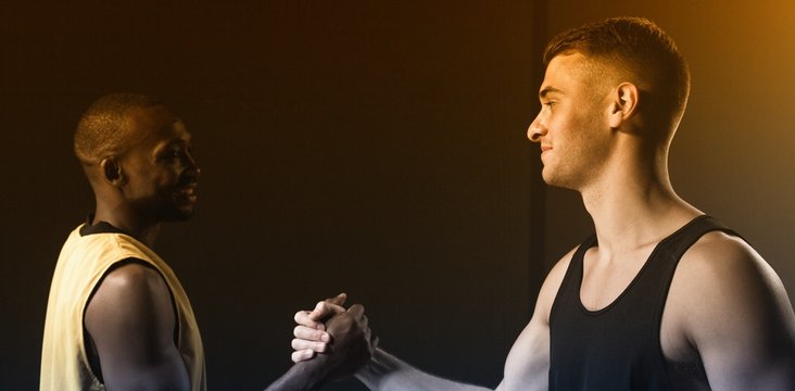 Portrait of basketball players shaking hands