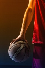 Close up on basketball held by basketball player © vectorfusionart