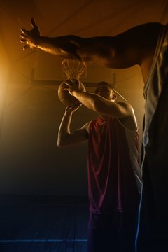 Portrait of men playing basket