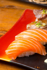 Assorted japanese sushi on a wooden plate
