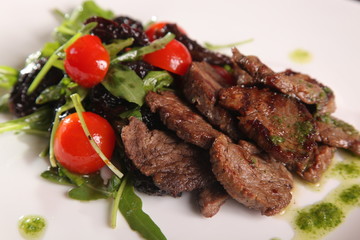 juicy meat with pesto and salad