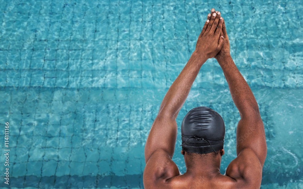 Canvas Prints Composite image of rear view of swimmer ready to dive