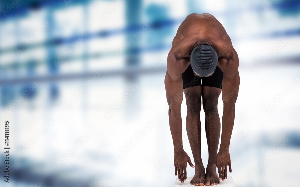 Canvas Prints Composite image of swimmer ready to dive