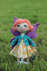 Little delicate handmade fabric textile doll girl butterfly with open eyes ginger hair and purple wings