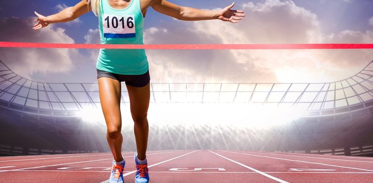 Composite image of sportswoman finishing her run