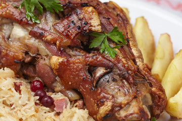 fried pork knuckle with potatoes and cabbage