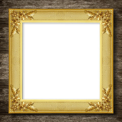 Antique gold frame on wooden wall background
