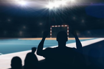 Composite image of silhouettes of football supporters