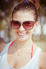 Fototapeta na wymiar smiling girl in sunglasses