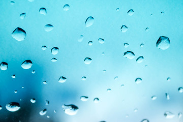 abstract photo of water drop on blue mirror