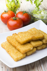 Meat croquettes served with fresh vegetables.