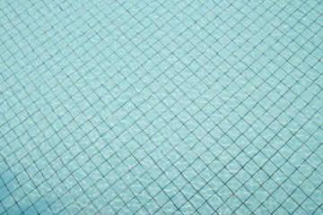 Fototapeta na wymiar blue swimming pool rippled water background
