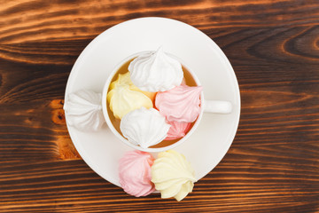Cup with light pink meringues