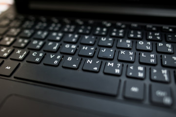 Laptop computer keyboard close-up ,Black Thai Keyboard close up