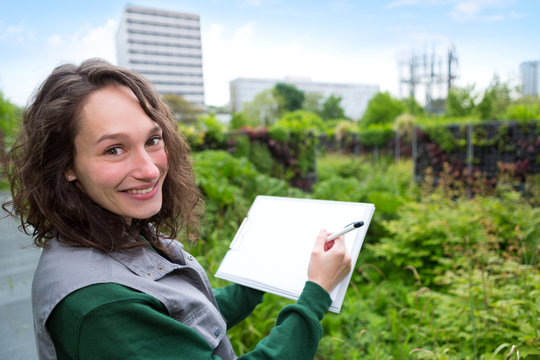 Young Attractive Landscaper Woman Working In A Public Park