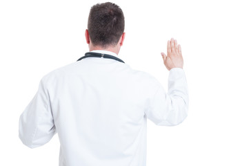 Fototapeta premium Back view of doctor swearing or having the Hippocratic oath
