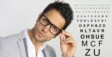 optometry - man holding his glasses