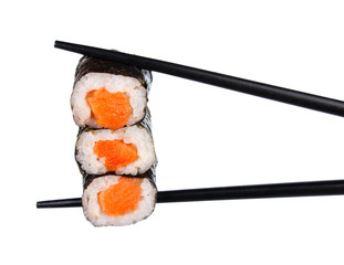 sushi roll in chopsticks Isolated on white