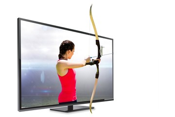 Composite image of side view of woman practicing archery