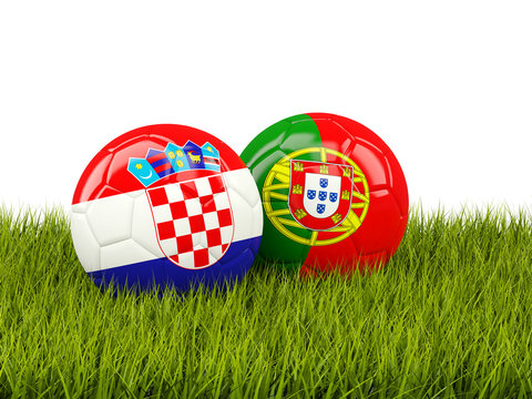Portugal and Croatia soccer balls on grass