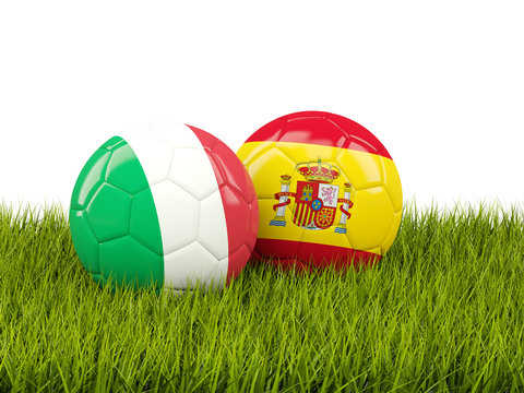 Italy and Spain soccer balls on grass