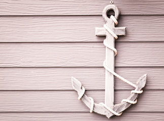 wooden anchor on wall vintage background
