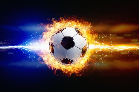 Abstract soccer background - bright powerful lightnings strike burning soccer ball