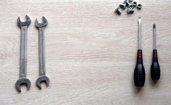 Mechanic tools with wooden background. Top view with copy space