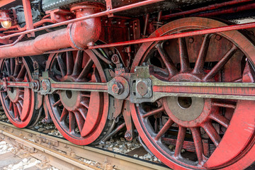 Fototapeta na wymiar Detail and close up of huge steam locomotive wheels