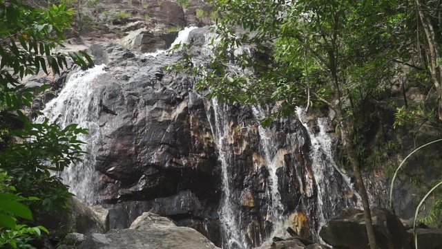 High waterfall in Thai jungle, slow motion video