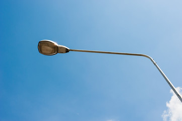 Street lamp on blue sky background