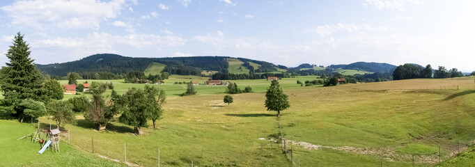 Allgau panorama, mountains and green meadows