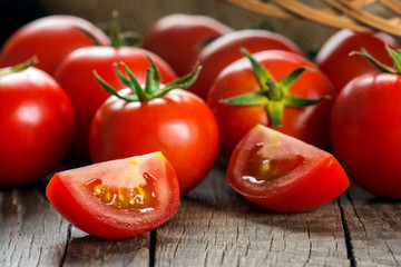 Tomatoes on wooden surface. Selective focus