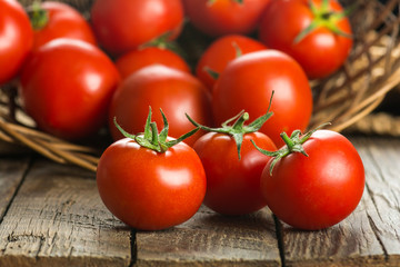 Tomatoes on wooden surface. Selective focus