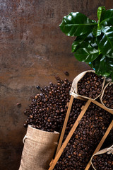 Jute bags and wooden containers filled with cofee beans