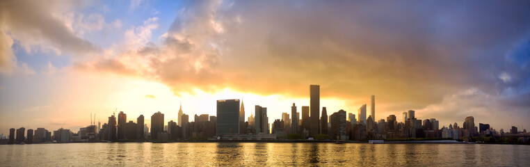 Fototapeta na wymiar Manhattan Midtown skyline panorama at sunset, New York City