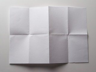 folded paper on a gray background